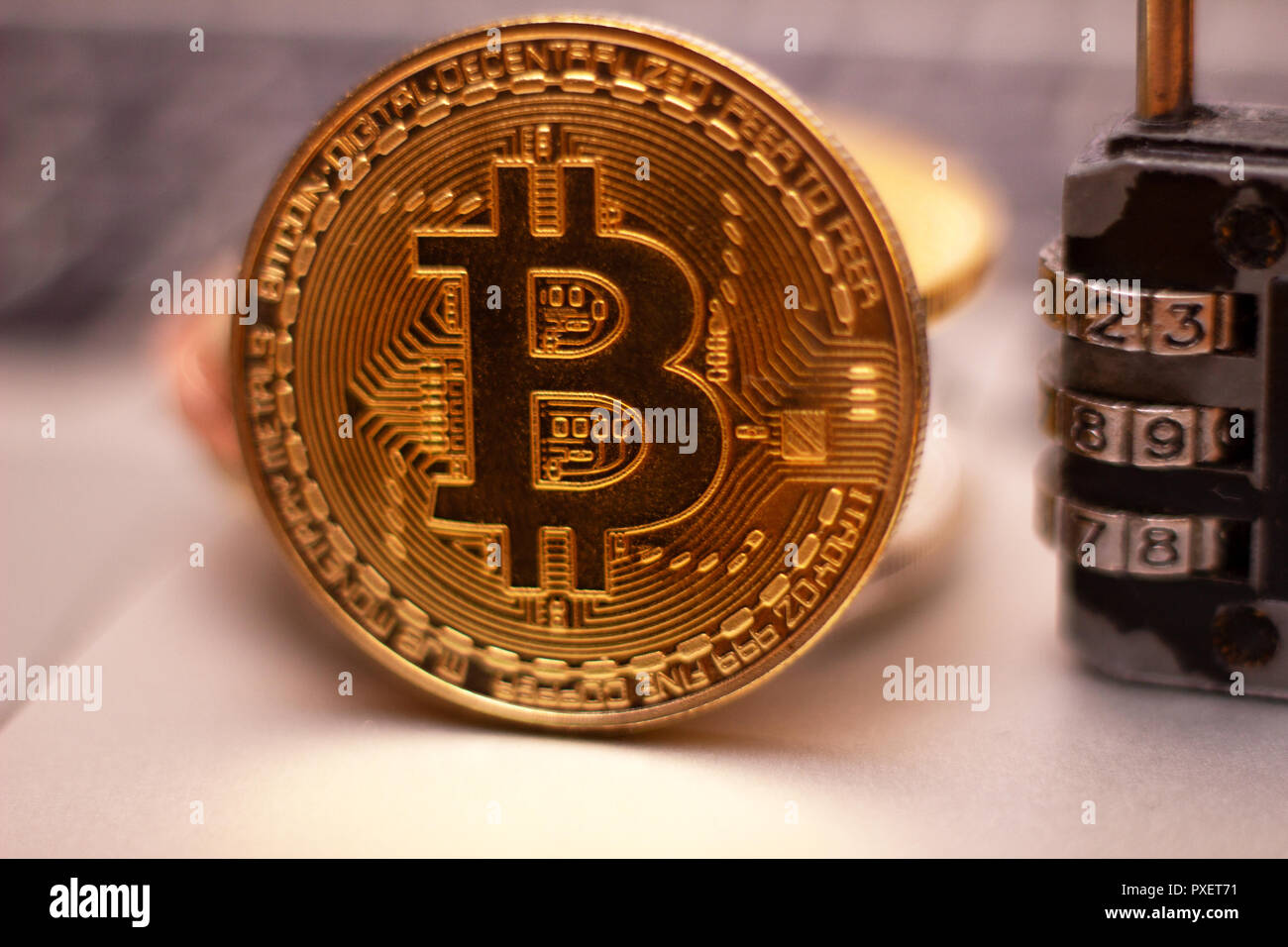 A Stack Of Silver Bitcoin Coin On A Silver Keyboard Of Laptop - 